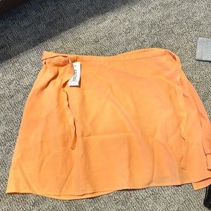 Orange wrap skirt from Aritzia. BNWT